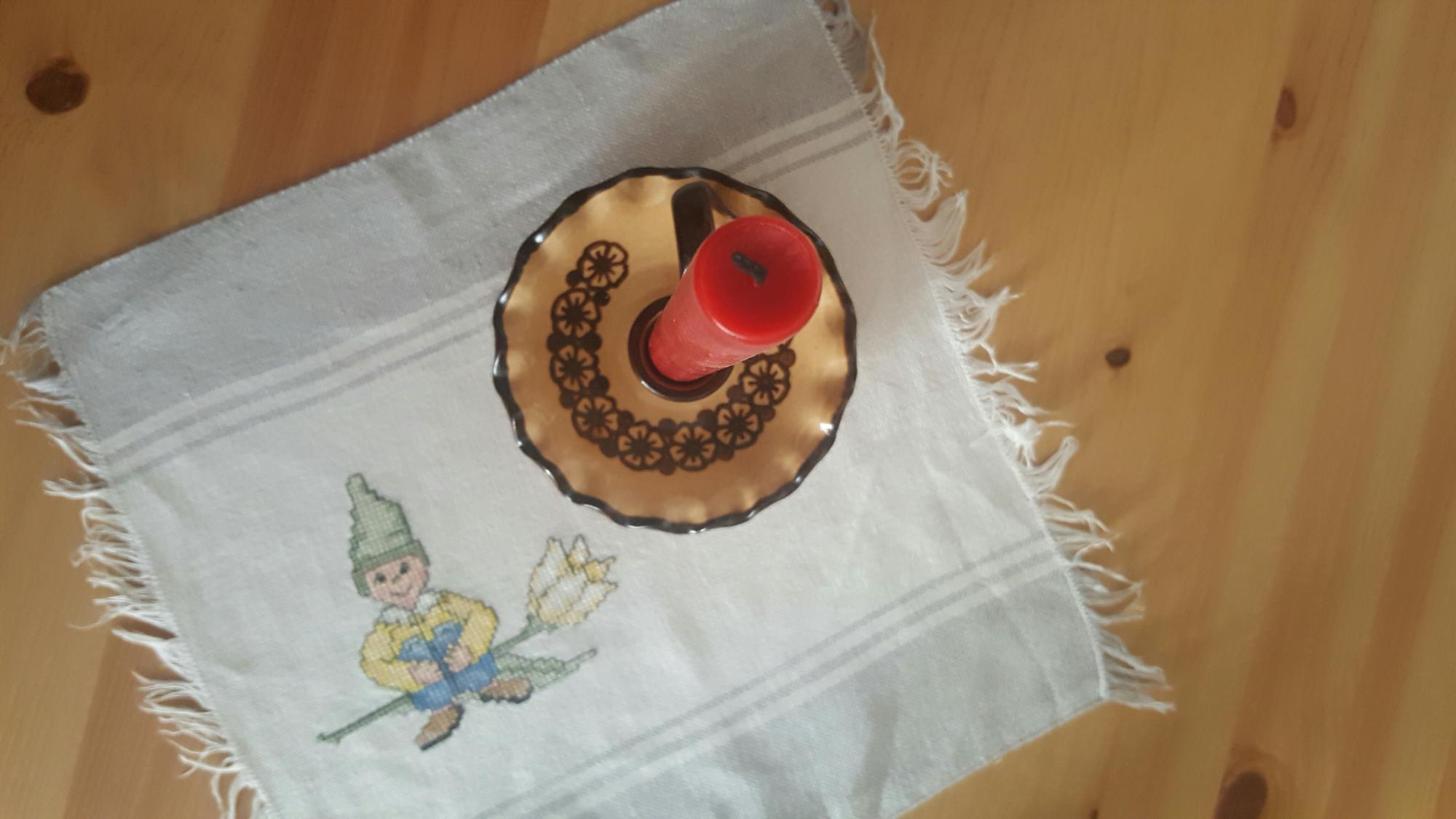 Hand-embroidered linen napkin with edge detail